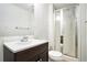 Bathroom featuring a shower, toilet, sink, and a dark wood vanity at 6300 Mountain Brook Ln, Atlanta, GA 30328