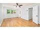 Bedroom featuring a ceiling fan, hardwood floors, and a window at 6300 Mountain Brook Ln, Atlanta, GA 30328