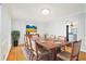 Formal dining room with hardwood floors, table, and views to the kitchen at 6300 Mountain Brook Ln, Atlanta, GA 30328