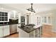 Modern kitchen features granite countertops, stainless steel appliances, ample cabinet space and kitchen island at 6300 Mountain Brook Ln, Atlanta, GA 30328