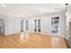 Spacious living room featuring hardwood floors, with a view of the sunroom at 6300 Mountain Brook Ln, Atlanta, GA 30328
