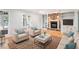 Inviting living room featuring a brick fireplace, built-in shelving, and neutral furnishings at 6300 Mountain Brook Ln, Atlanta, GA 30328