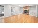 Bright living room with hardwood floors and a brick fireplace with built in shelving at 6300 Mountain Brook Ln, Atlanta, GA 30328