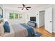 Airy primary bedroom with a ceiling fan, natural light, and stylish furnishings, creating a serene retreat at 6300 Mountain Brook Ln, Atlanta, GA 30328
