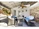 Covered patio featuring comfortable outdoor seating, ceiling fan, and views of the backyard pool area at 6300 Mountain Brook Ln, Atlanta, GA 30328