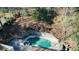 Aerial view of pool, surrounded by trees at 6300 Mountain Brook Ln, Atlanta, GA 30328