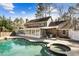 Backyard pool with ample decking, adjacent to sunroom and patio at 6300 Mountain Brook Ln, Atlanta, GA 30328