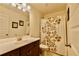 Bathroom featuring a single vanity and a shower with a floral-patterned curtain at 133 Canal St, Hampton, GA 30228