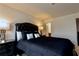Bedroom featuring a dark bed, dark dresser, dark nightstand, and carpeted floors at 133 Canal St, Hampton, GA 30228