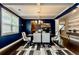Formal dining room with stylish decor and elegant lighting fixture at 133 Canal St, Hampton, GA 30228