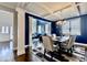 Chic dining area featuring elegant decor and a dark blue accent wall at 133 Canal St, Hampton, GA 30228