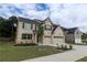 Beautiful two-story home with a two-car garage, set in a landscaped yard at 133 Canal St, Hampton, GA 30228