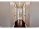 Hallway leading to a bathroom with tiled shower and soaking tub at 133 Canal St, Hampton, GA 30228