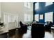 Stylish living room with high ceilings, hardwood floors, and comfortable seating at 133 Canal St, Hampton, GA 30228