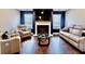 Comfortable living room with a fireplace, large TV, and plush reclining chairs at 133 Canal St, Hampton, GA 30228