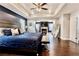 Spacious main bedroom featuring dark wood floors, a fireplace and sitting area at 133 Canal St, Hampton, GA 30228