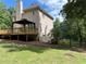 The home features a large wooden deck, a gazebo, and a fenced in yard at 1502 La Fayette Pl, Loganville, GA 30052