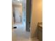 Bright bathroom features a tiled floor, modern shower with glass door at 1502 La Fayette Pl, Loganville, GA 30052