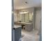 Spacious bathroom featuring double vanities, granite counters, and tile floors at 1502 La Fayette Pl, Loganville, GA 30052