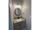 A clean and simple powder room with a granite countertop and an undermount sink at 1502 La Fayette Pl, Loganville, GA 30052