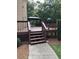 Backyard deck and gazebo, featuring stained wood and a sidewalk for easy backyard access at 1502 La Fayette Pl, Loganville, GA 30052