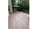Stained wood deck featuring trees and a gazebo at 1502 La Fayette Pl, Loganville, GA 30052