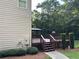Side view of a stained wood deck with grill and gazebo in wooded backyard at 1502 La Fayette Pl, Loganville, GA 30052