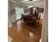 Dining area featuring a chandelier, large window, and elegant wood furniture at 1502 La Fayette Pl, Loganville, GA 30052