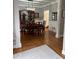 Elegant dining room with hardwood floors, wainscoting, and a china cabinet at 1502 La Fayette Pl, Loganville, GA 30052
