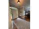 Warm, naturally lit foyer showcasing hardwood floors and a decorative console table at 1502 La Fayette Pl, Loganville, GA 30052