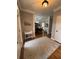 Spacious entry way showcases hardwood floors and charming decor leading to the dining room at 1502 La Fayette Pl, Loganville, GA 30052