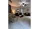 Comfortable living room features neutral decor, plush seating, and a ceiling fan at 1502 La Fayette Pl, Loganville, GA 30052