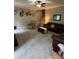 Spacious living room with plush carpet, neutral walls, and a staircase at 1502 La Fayette Pl, Loganville, GA 30052
