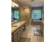 Bright bathroom featuring double vanities, soaking tub, and separate shower at 1502 La Fayette Pl, Loganville, GA 30052