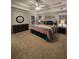 Bright bedroom featuring trey ceilings, fan, and comfortable furnishings at 1502 La Fayette Pl, Loganville, GA 30052