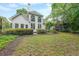 Landscaped backyard with large rear windows on the home's exterior at 1996 Wellesley Trce, Atlanta, GA 30338