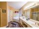 Bathroom featuring double sinks, a soaking tub, and a separate shower for a spa-like experience at 1996 Wellesley Trce, Atlanta, GA 30338