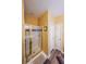Bathroom with a glass-enclosed shower featuring gold trim and modern fixtures at 1996 Wellesley Trce, Atlanta, GA 30338