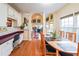 Dining area with hardwood floors and a desk area with white cabinetry at 1996 Wellesley Trce, Atlanta, GA 30338