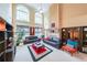 Bright and airy living room boasts high ceilings, large windows, and comfortable seating at 1996 Wellesley Trce, Atlanta, GA 30338