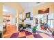Inviting living area with fireplace, colorful art, hardwood floors, and lots of natural light at 1996 Wellesley Trce, Atlanta, GA 30338