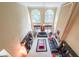 Open-concept living room featuring high ceilings, large windows, and comfortable seating at 1996 Wellesley Trce, Atlanta, GA 30338