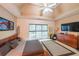 Spacious bedroom featuring a tray ceiling, large windows, and sleek, modern furnishings at 1996 Wellesley Trce, Atlanta, GA 30338