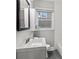 Clean bathroom featuring a modern vanity and tiled wall at 2025 Venetian Sw Dr, Atlanta, GA 30311