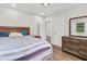 Well-lit bedroom featuring modern furnishings and hardwood floors at 2025 Venetian Sw Dr, Atlanta, GA 30311