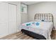 Bedroom featuring a queen-sized bed, closet and a window for natural light at 2025 Venetian Sw Dr, Atlanta, GA 30311