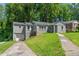 Gray painted house with a one-car garage and a double wide driveway at 2025 Venetian Sw Dr, Atlanta, GA 30311