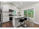 Modern kitchen featuring an island with seating and stainless steel appliances at 2025 Venetian Sw Dr, Atlanta, GA 30311