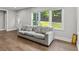 Bright and airy living room with hardwood floors and large windows at 2025 Venetian Sw Dr, Atlanta, GA 30311