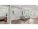 Bright living room features hardwood floors, large windows and a decorative front door at 2025 Venetian Sw Dr, Atlanta, GA 30311
